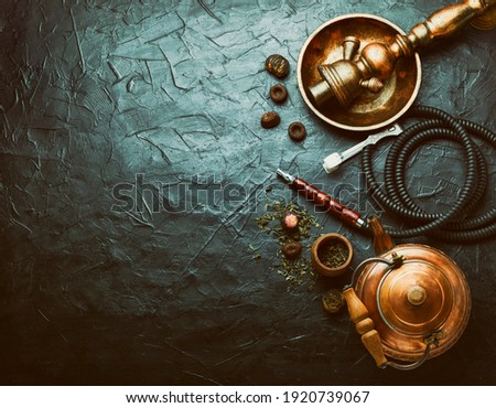 Eastern shisha or hookah for relaxation and teapot with tea.Copy space