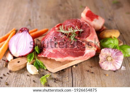 raw beef and vegetable on board