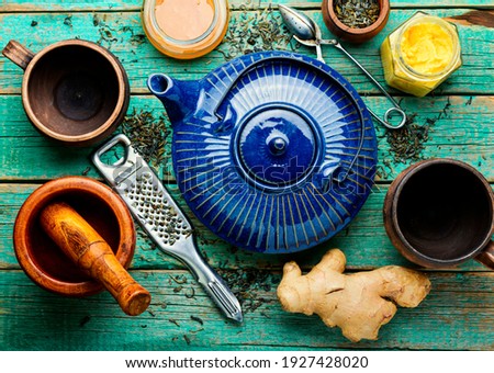 Teapot with tea made from ginger,honey and lemon.Vitamin, healing tea
