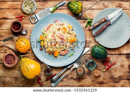 Traditional italian dish spaghetti carbonara with pumpkin and bacon.Pasta carbonara.Pasta with baked pumpkin