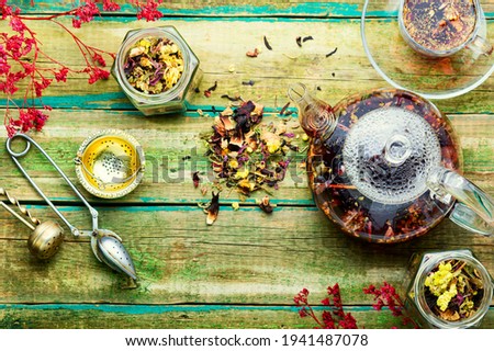 Healthy flower tea in a glass teapot.Natural herbs medicine