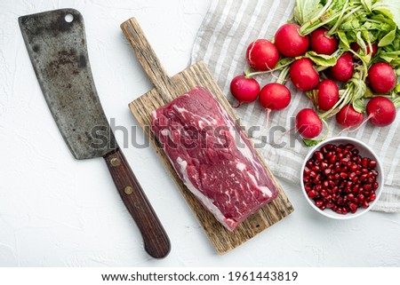 Raw beef fillet steaks with spices and whole marbled tenderloin cut set, on white stone background, top view flat lay, with copy space for text