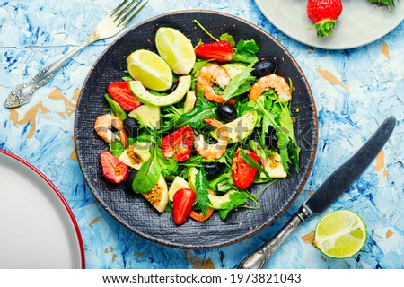 Fresh summer salad with prawn,strawberry,avocado,lime and olive.Summer salad,healthy eating