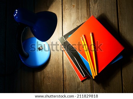 School tools and the fixture. On a wooden background.