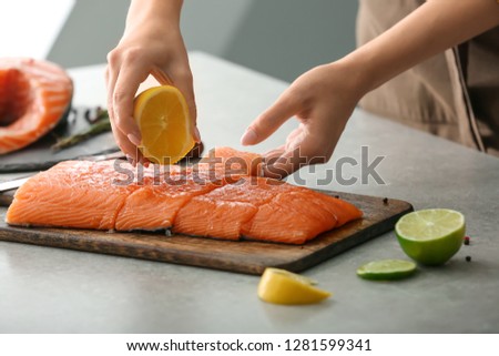 Similar – Image, Stock Photo Raw fish with lemon and herbs