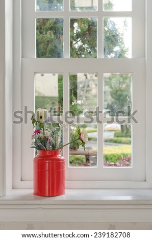 vase of flower with window frame at home