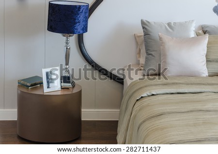 blue classic lamp on round table in bedroom at home
