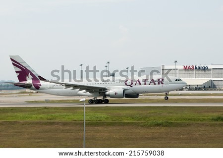 SEPANG, MALAYSIA - AUGT 4: Airbus A330 registered with number A7-AFP owned by Qatar Airways take off from Kuala Lumpur International Air Port, Sepang, Malaysia on August 4, 2014.
