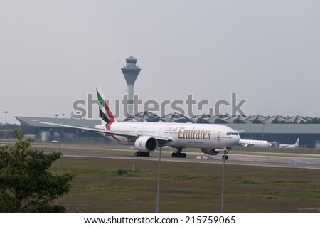SEPANG, MALAYSIA - AUGT 4: Boeing 777 registered with number A6-EGX owned by Emirates ready to take off at Kuala Lumpur International Air Port, Sepang, Malaysia on August 4, 2014.