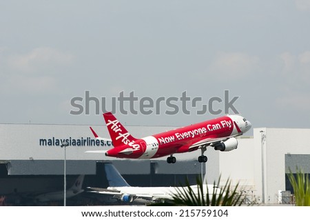 SEPANG, MALAYSIA - AUGT 4: Airbus A320 registered with number 9M-AQX owned by Air Asia take off from Kuala Lumpur International Air Port, Sepang, Malaysia on August 4, 2014.