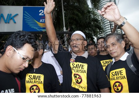 KUALA LUMPUR, MALAYSIA-MAY 20: Demonstrators during a protest against a proposed rare earth plant to be built in Gebeng, in front of Petronas Twin Towers in Kuala Lumpur May 20, 2011.