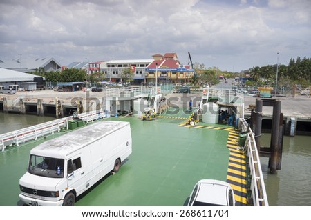 KUALA PERLIS, PERLIS - MARCH 30: Ferry to Langkawi island awaiting cars before depart at Kuala Perlis jetty, 500 km nort off Kuala Lumpur, Malaysia on March 30, 2015.
