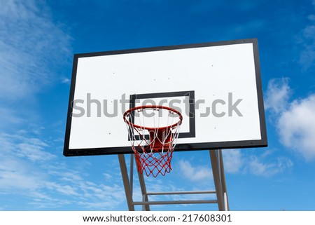 basketball hoop stand at playground in park on sky background