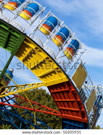 Colorful merry-go-round in a summer park.