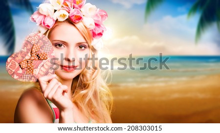 blonde woman with tulip hair decoration and a heart gift box