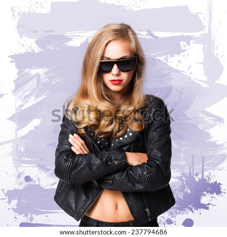 young girl with sun glasses and leather jacket with crossed arms
