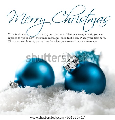 christmas balls in the snow with merry christmas greeting and sample text