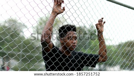 Similar – Image, Stock Photo Pensive millennial ethnic athlete relaxing after training on wooden stairs in park