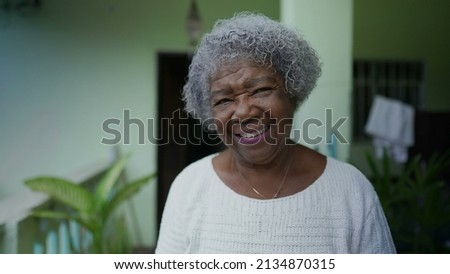 Similar – Image, Stock Photo Senior woman with face mask looking out of window at home