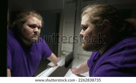 Similar – Image, Stock Photo Overweight male with mirror applying red lipstick