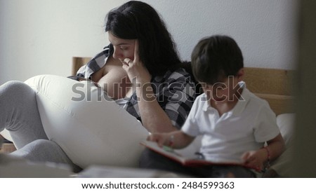 Similar – Image, Stock Photo Mother nursing while read a book