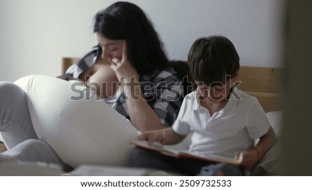 Similar – Image, Stock Photo Mother nursing while read a book