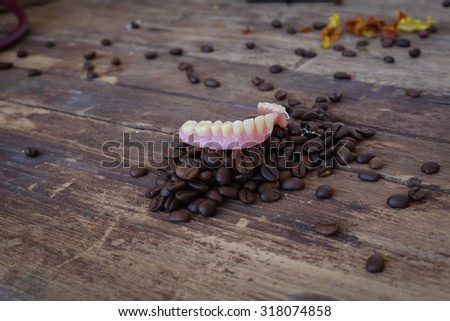 false tooth on coffee beans