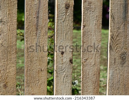 The boards of the wooden fence close-up