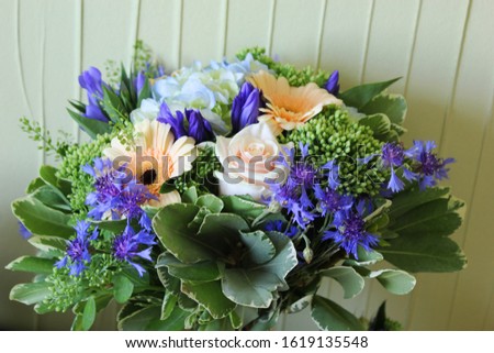 Similar – Image, Stock Photo Bouquet: gerbera and roses in yellow and pink in light blue watering can stands on stone floor