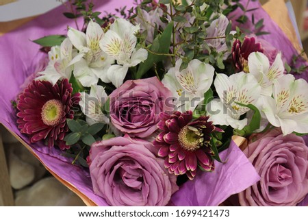 Similar – Image, Stock Photo Bouquet: gerbera and roses in yellow and pink in light blue watering can stands on stone floor