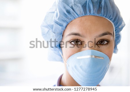 Similar – Image, Stock Photo caucasian doctor wearing protective mask and gloves indoors. Using an alcohol gel or antibacterial disinfectant. Hygiene and corona virus concept