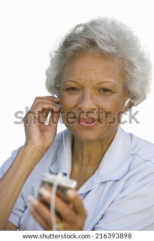 close-up of senior woman listening to earphones, cut out