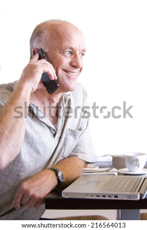 senior man on telephone with cup of coffee, cut out