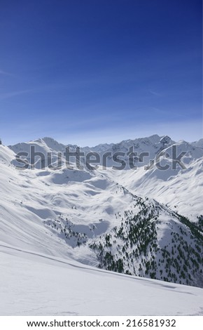 View of snowy mountain range and blue sky