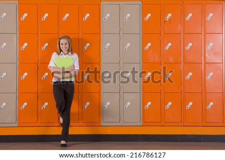 Student leaning on school lockers