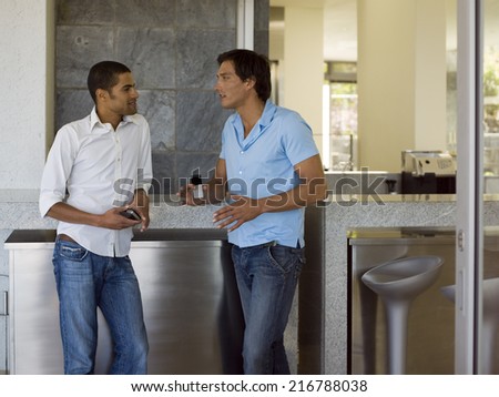 Two men talking.