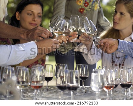 Wine tasters tasting wine.