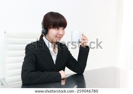 business customer support operator woman with a cup of hot drink
