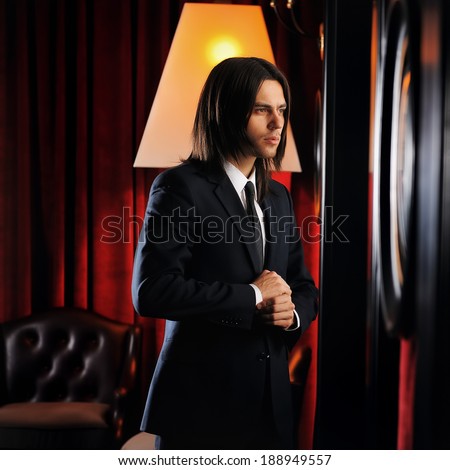 portrait of a man in a suit at the club