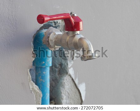Fixing leaked water pipe on the wall