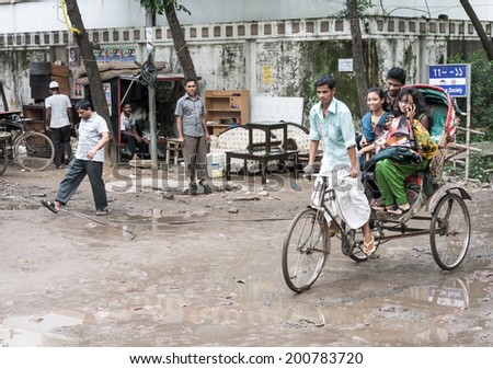 AUGUST 10.2012-DHAKA, BANGLADESH: the easiest way of getting around the city is by taxi or auto-rickshaws In an attempt to reduce air pollution.