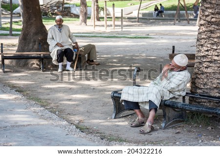 SEPTEMBER 15.2013, TANGIER MOROCCO: In the picture we can see two people resting in the shade in a central park of Tangier.