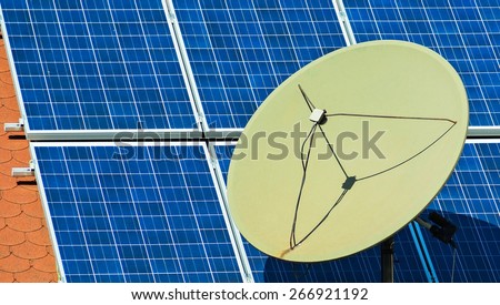 Solar panels and satellite dish on the roof of a building