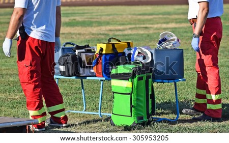 Ambulance staff with medical equipments