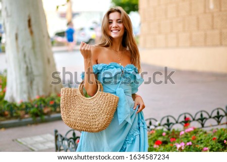 Similar – Image, Stock Photo Trendy woman with bag standing near lake