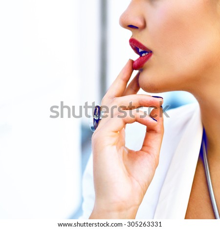 Close up sexy woman face with perfect skin and gores full red lips, put a finger to her mouth , pastel toned colors, pure seductive beauty .