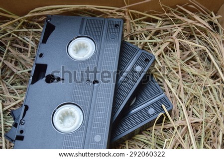 video recorder cassette on straw in the box