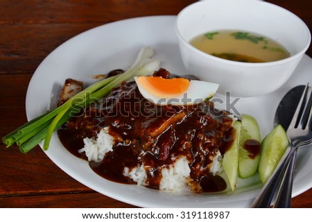 barbecue pork dressing sweet sauce and boiled egg