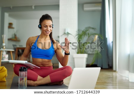 Similar – Image, Stock Photo Fitness woman consulting her training on her smartphone sitting in a jump box in the gym