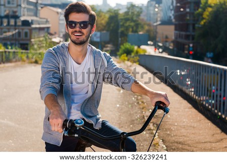 Similar – Foto Bild Fröhlicher Mann mit Fahrrad auf Steg stehend